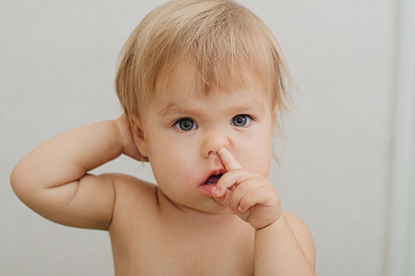45380248 - caucasian baby child portrait picking his nose